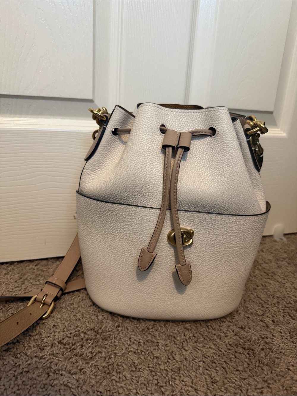 Coach Pebbled Leather Drawstring Bucket Bag in Cream and Tan